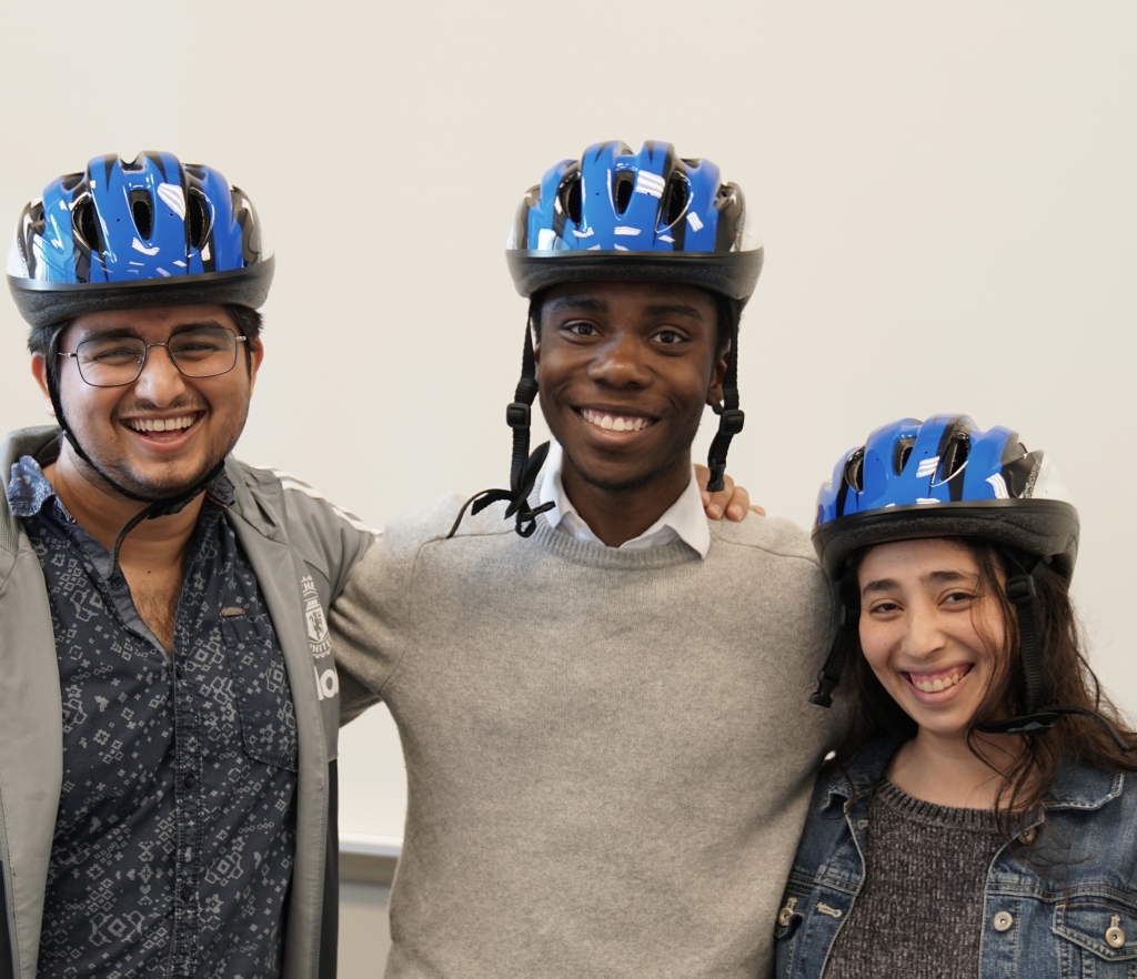 3 individuals wearing safety helmets