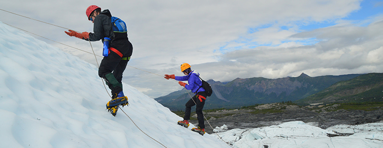 2 students repelling on glacier