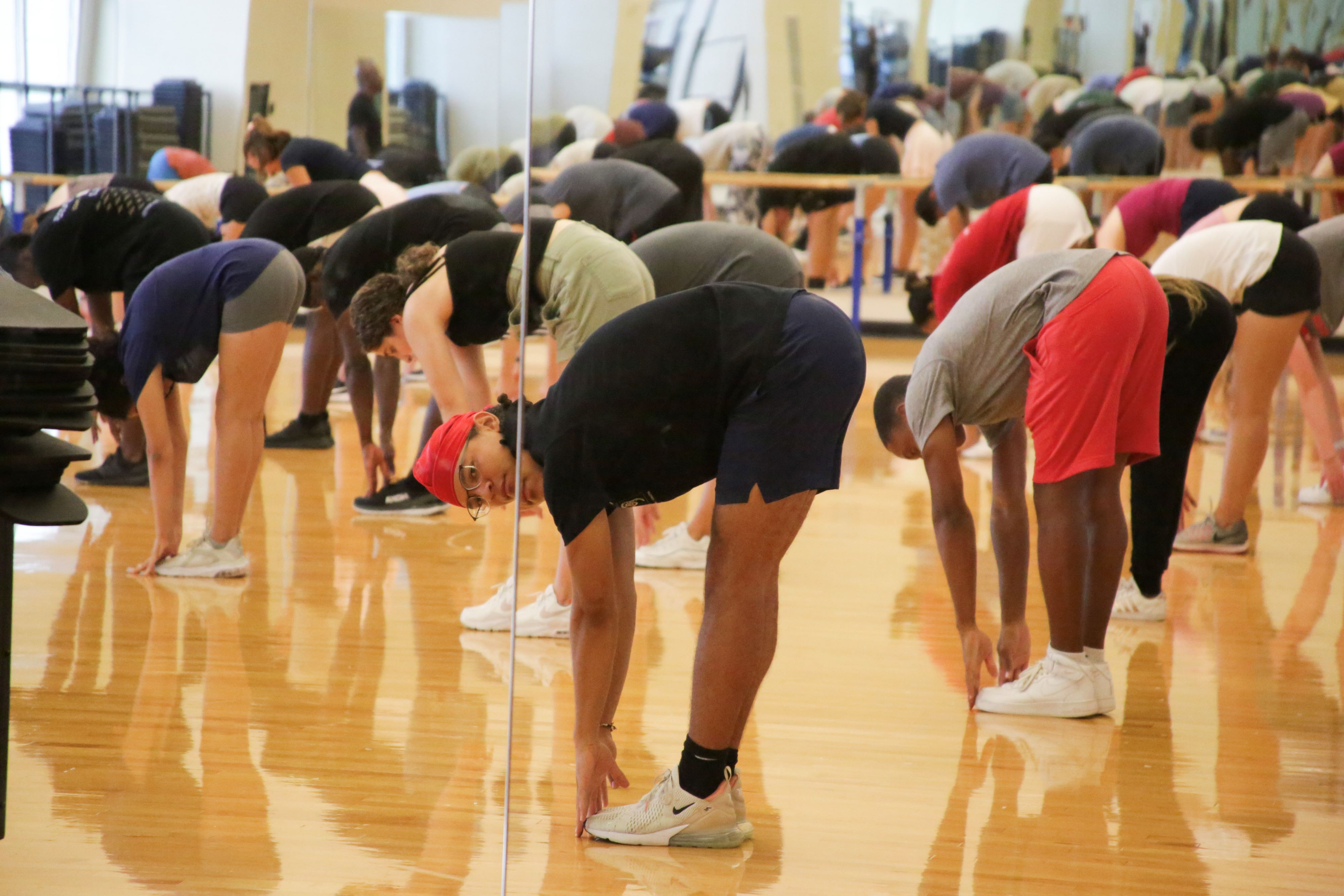 Participants stretching during a group fitness class